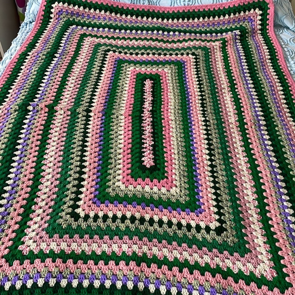 Knitted afghan /throw vintage item greens/pinks with a hint of purple